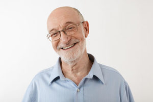 senior man smiling with clean home from senior living housekeeping services in boca raton fl